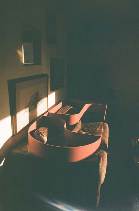 Powder-coated aluminum hooks and shelving on the Chloë armoire by Houndz