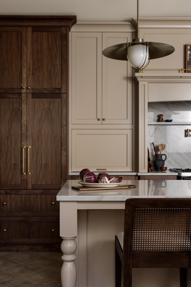 Nelson kitchen by Covet Interiors with walnut millwork and white pearl quartzite countertops