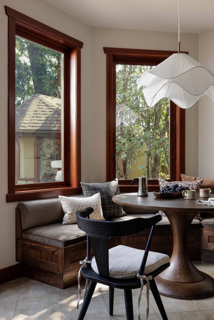 Custom walnut banquette dining nook in a Nelson kitchen by Covet Interiors