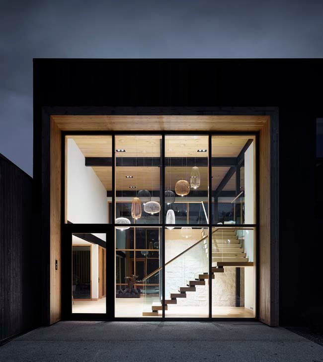 V Residence entry hall at night by 1×1 Architecture, Winnipeg