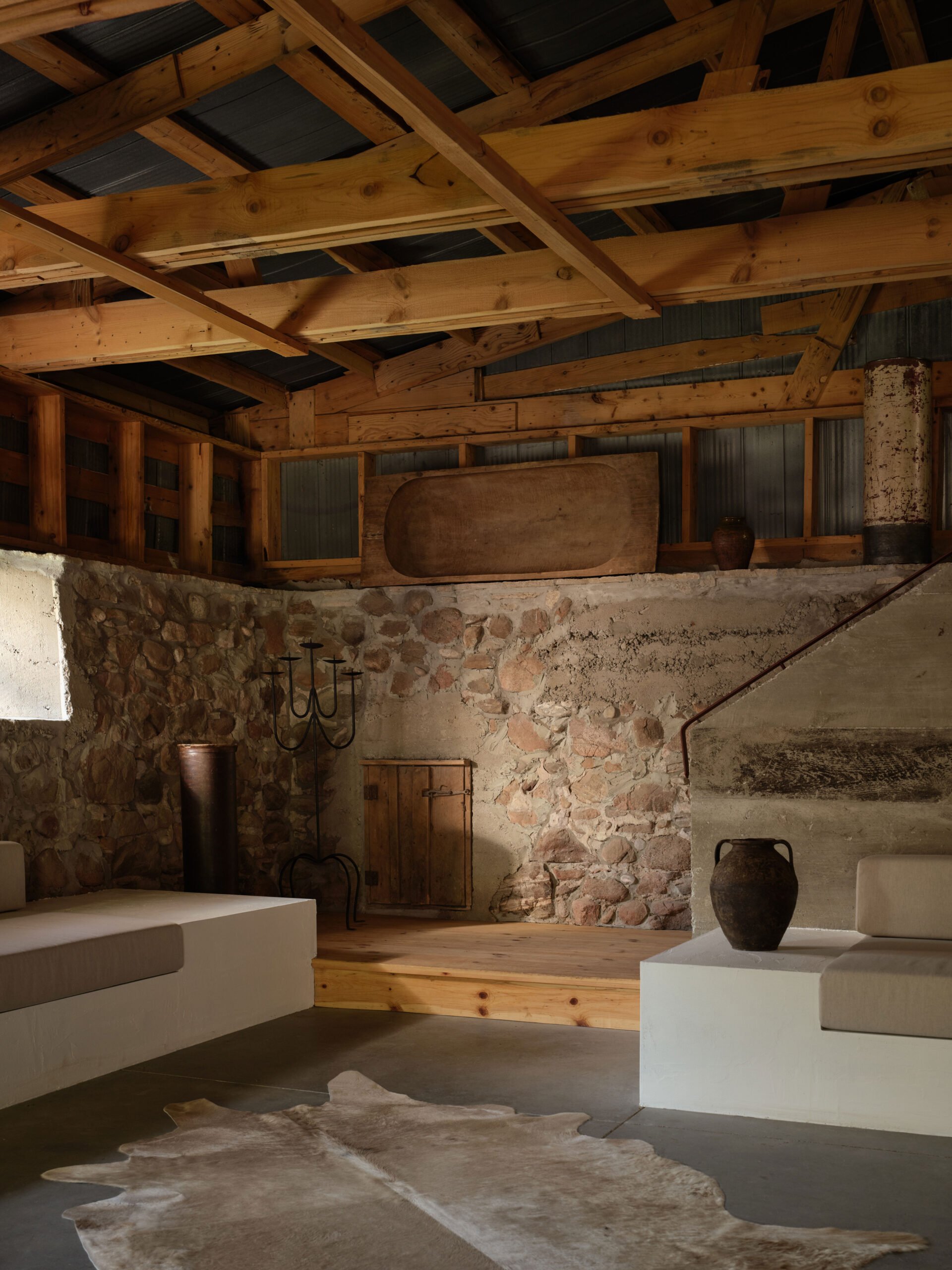 Ontario pine stair leading to the hayloft at The Barn entry foyer, designed by &Daughters