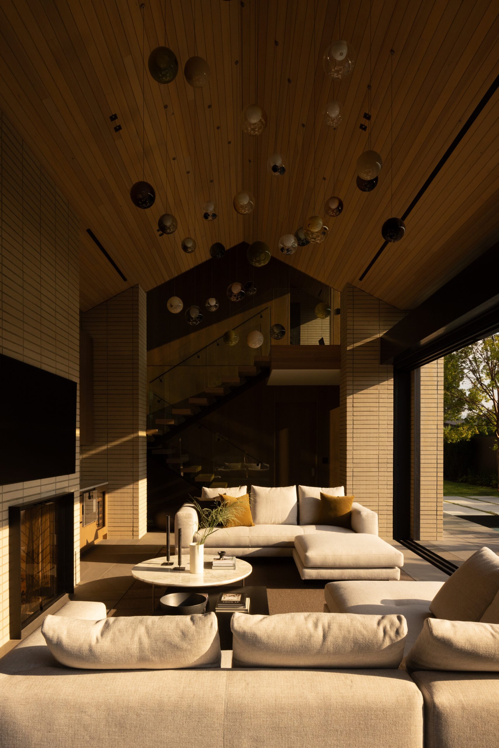 Seating area and refined palette in the Brick House great room, North Vancouver