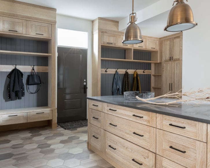 Whitewashed oak mudroom millwork with grey beadboard by Nyla Free Designs