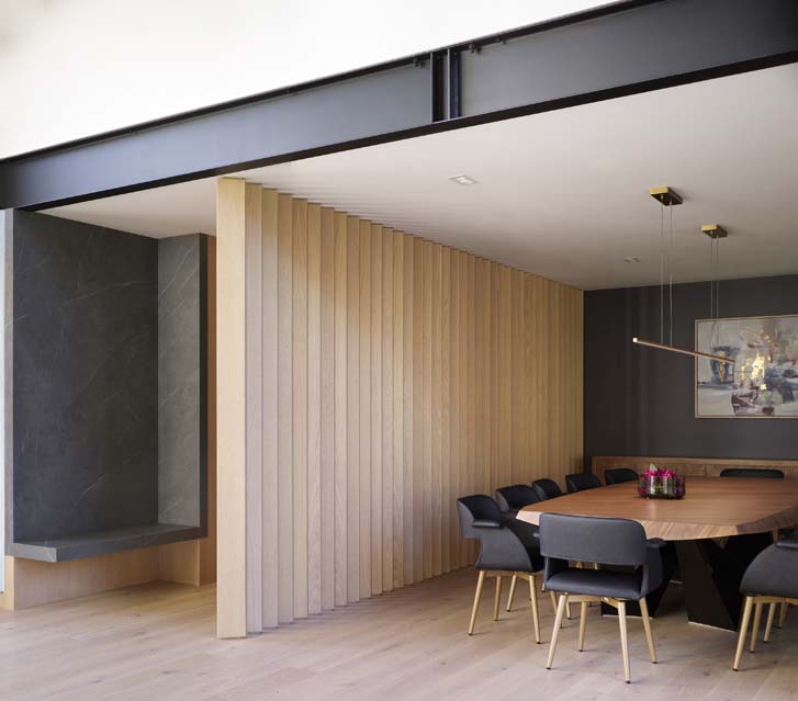 Slat wall detail connecting the V Residence entry hall and dining area, Winnipeg