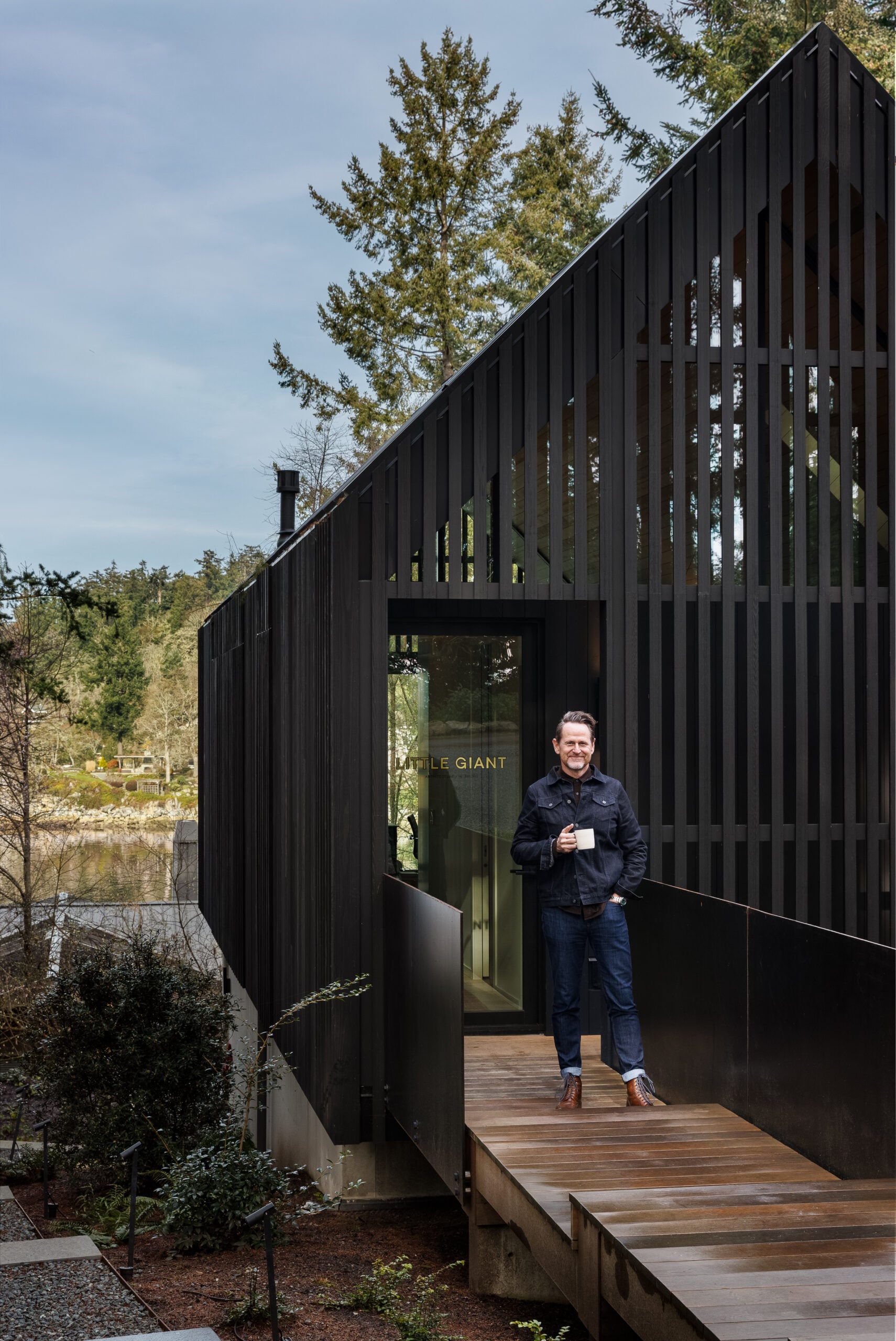 Mark Burkart standing outside entrance to studio