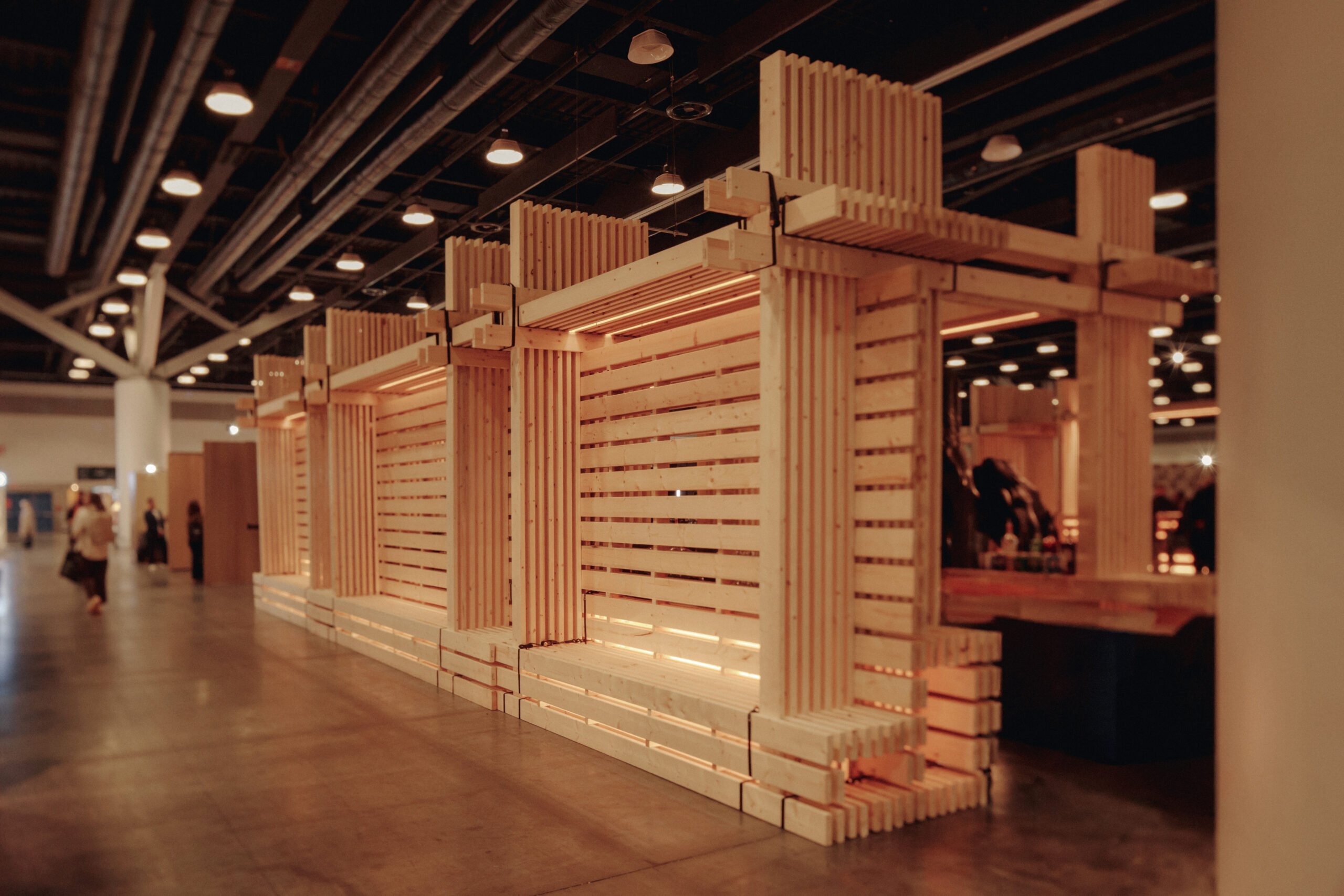 In/tension fastener-free bar and bench installation by dHKarchitects at IDS Vancouver