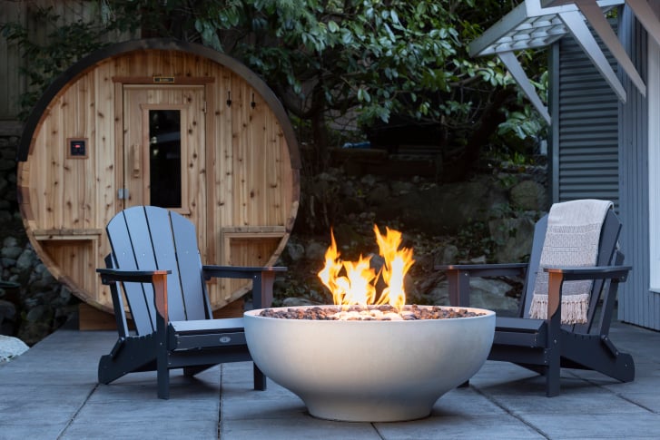 White Luna 42 fire bowl by Solus Decor on an outdoor patio