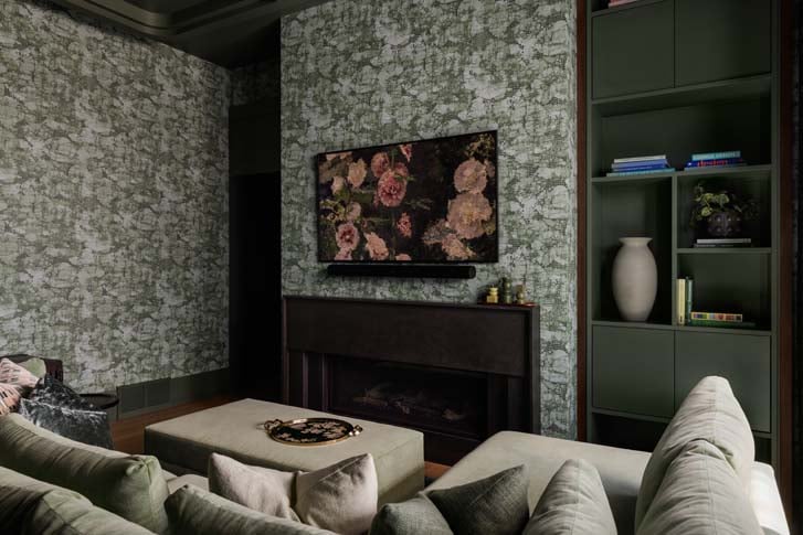 Emerald cabinetry and pistachio ceiling in the East Elbow Residence hidden lounge, Calgary