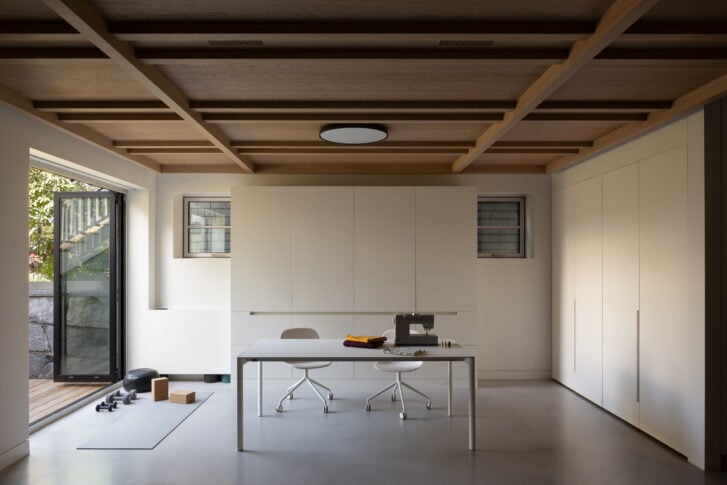 Oak-panelled ceiling over lower level with sliding doors to patio and garden views