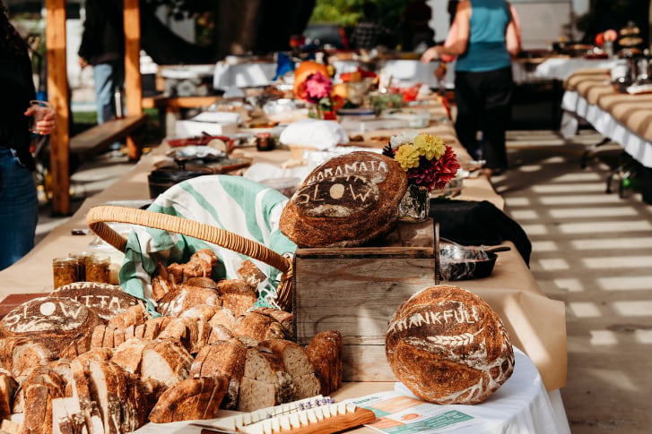 Guests dining together outdoors at the Naramata Harvest Dinner