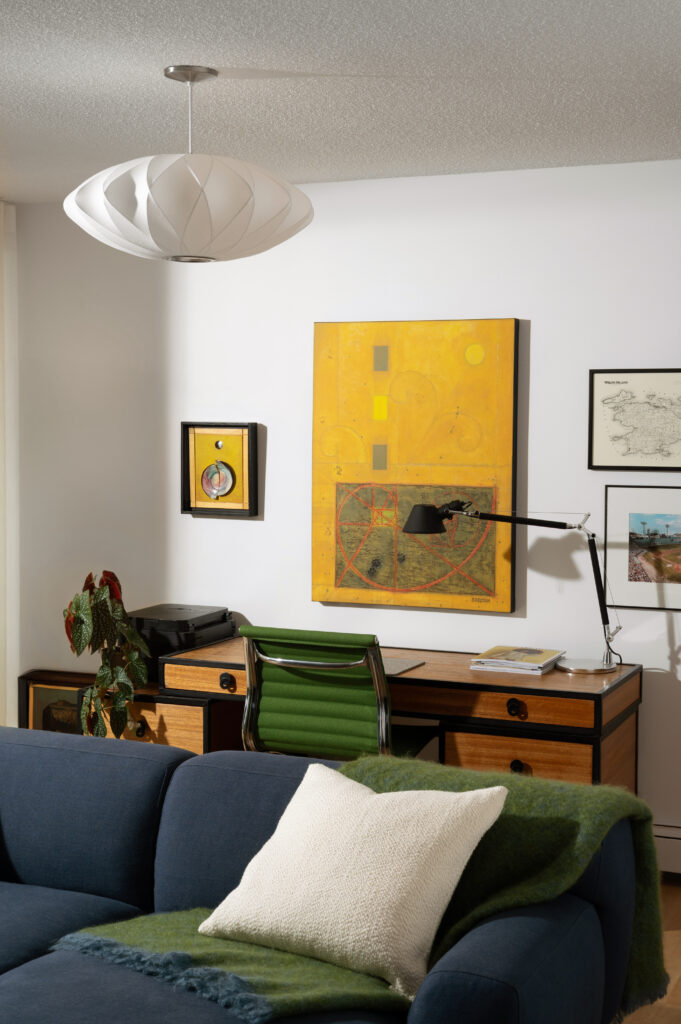 close up view of blue sofa and vintage desk