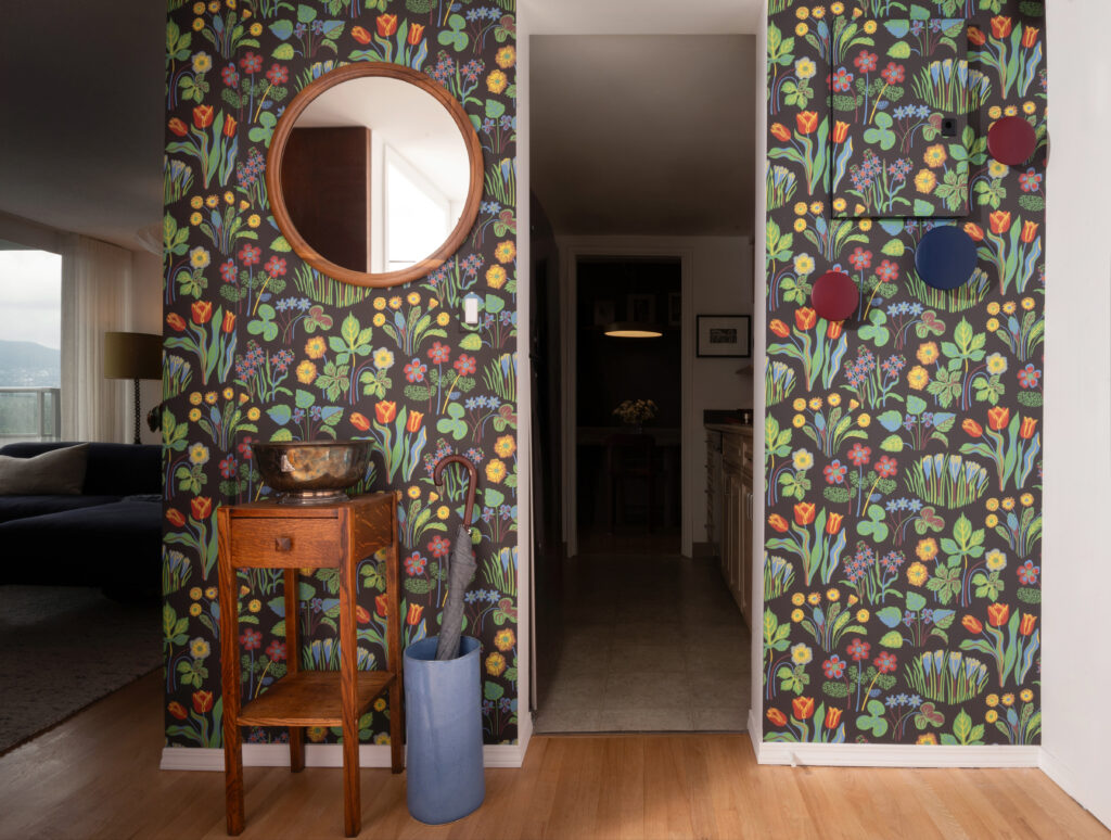 dark floral wallpaper at apartment entryway