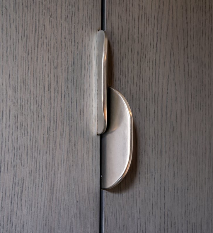 Sculptural bronze Rendezvous cabinet pull by Rocky Mountain Hardware