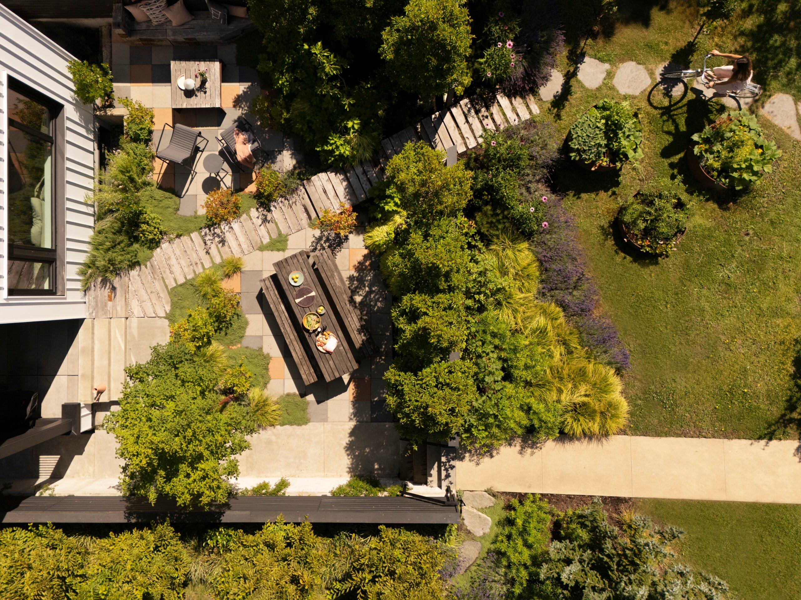 Sculptural stramp stair-ramp feature at Rail Yard outdoor dining room by Measured Architecture