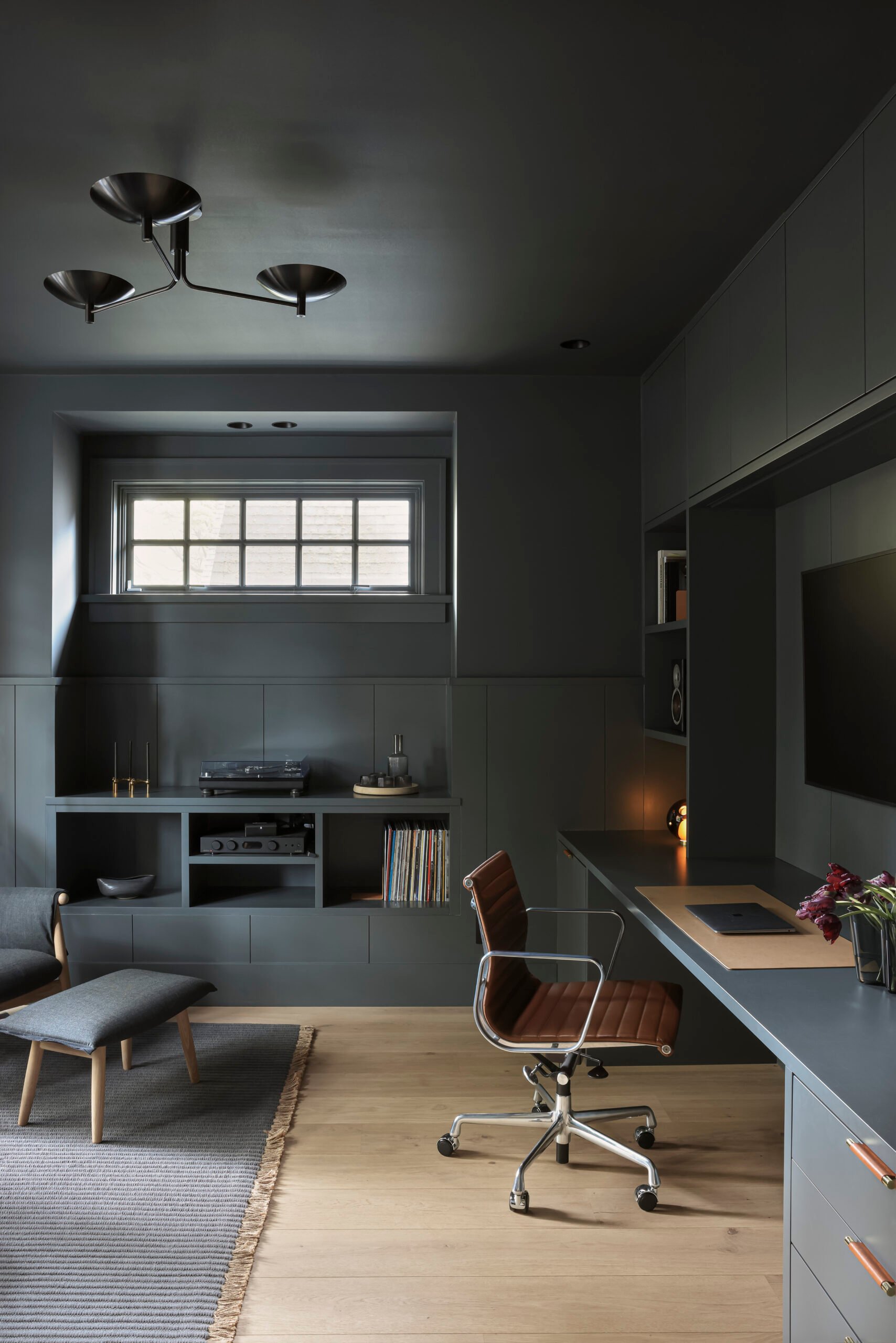 Smoky blue-grey millwork in the Wallace House den by Sophie Burke Design