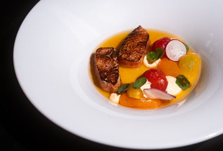 Steelhead, tomato and spot prawn dish at Ugly Duckling restaurant in Victoria