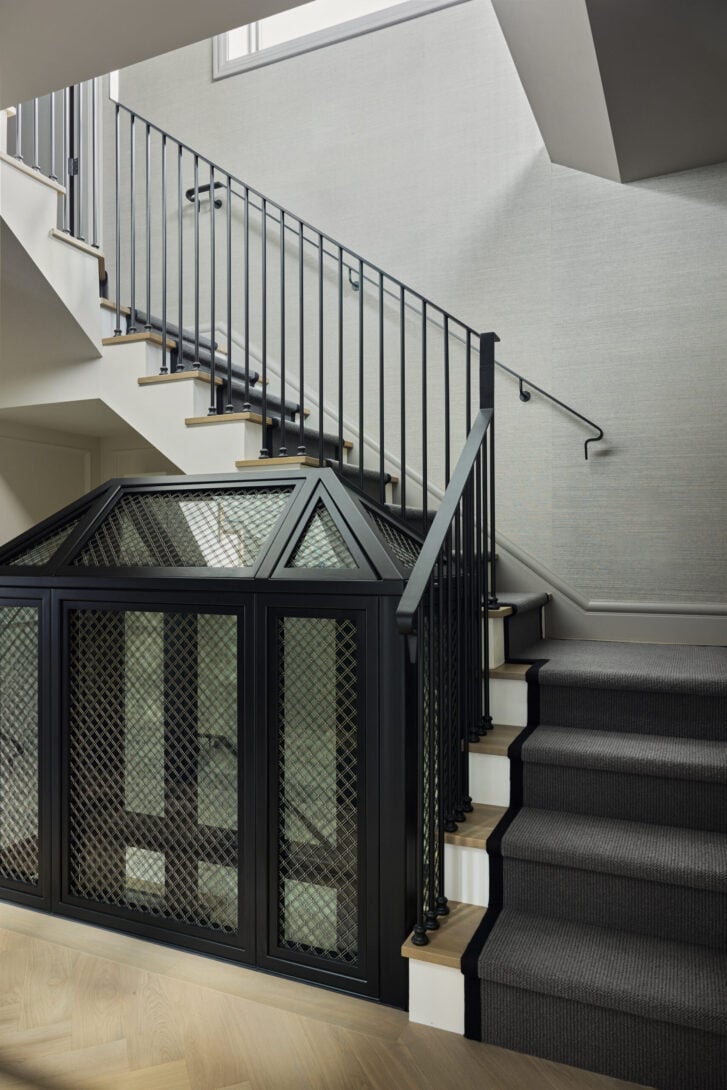 Steel, mesh and glass details in the elevator-inspired wine tower by Stephanie Brown Inc.