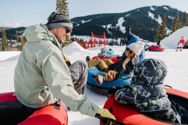 Family enjoying snow tubing at Sun Peaks Resort