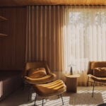 Living room with leather chairs and sheer curtains
