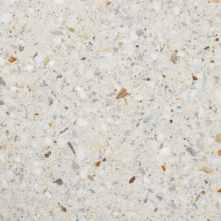 Close-up of pale Veronese Crema terrazzo tile with blue and golden marble fragments